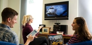Can I Mount a TV Myself? A Realistic Look at DIY vs. Professional Services Students watching TV