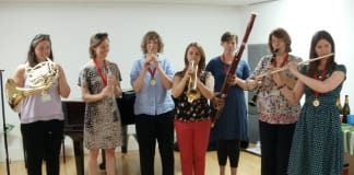 WNO orchestra takes on new instrument challenge for Action for Children members of wno orchestra in last minute practice
