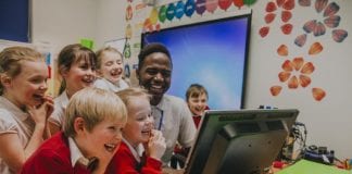 LGA RESPONDS TO CHILDREN SECURING PRIMARY SCHOOL PLACES Primary schoolchildren around a computer