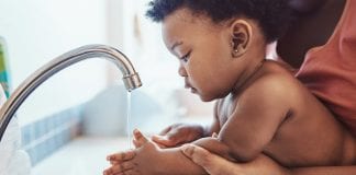 Community spirit and pulling together key to maintaining key NPT Swansea family service baby washing hands