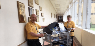 Health volunteers thanked for incredible support Dafi Davies and Aeres Davies helping with Glangwili Hospital shop trolley before Covid 19 pandemic