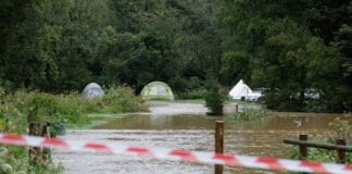 Flood water rescue near St Clears – 25/08/20 0 PAY Firefighters rescued campers after Lakeside campsite flooded in near St Clears west Wales UK