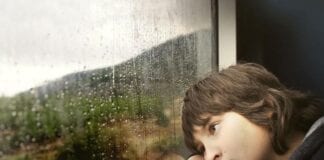 LGA RESPONDS TO CHILDREN’S COMMISSIONER BRIEFING Boy looking out a rainy window