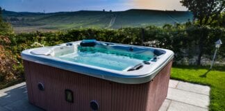 NICEIC RAISES ELECTRICAL SAFETY CONCERNS AS HOMEOWNERS SPLASH OUT ON LOCKDOWN HOT TUBS shutterstock 724594510 min scaled