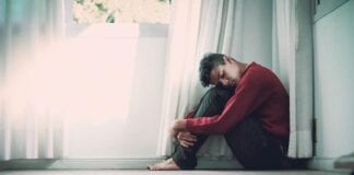 LGA RESPONDS TO REPORT ON HOW UP TO 10 MILLION PEOPLE MAY NEED MENTAL HEALTH SUPPORT DUE TO CORONAVIRUS young man on the floor