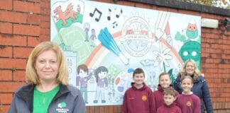 Ashmole & Co Ammanford helps fund the accountants of the future with donation to Llandybie Primary School laura Craddock from Ashmole and Co at llandybie school