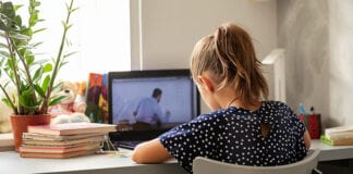 Uswitch’s expert broadband tips for improving homeschooling and working from home girl attending school from home