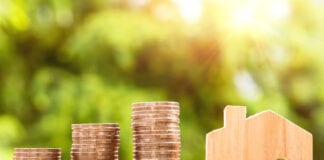 20,000 affordable homes target to be exceeded by end of government term Canva Piled Coins and Miniature House scaled