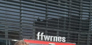 Local student celebrates two years as theatre ambassador Ewan Richards outside the Ffwrnes scaled