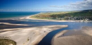 Vital funding to boost coastal towns continued thanks to Welsh Government support Aerial view of Dovey Dyfi Estuary Aberdovey Aberdyfi