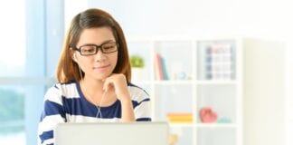 Free online careers event to support students year 9 and over in west Wales Stock photo of student at computer