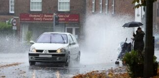 More than one in four Welsh drivers have deliberately splashed a pedestrian on the pavement car splashing puddle