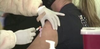 A million COVID autumn booster vaccines administered in Wales 10558134 042821 kgo woman getting vaccine img