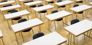 NAHT Cymru comments on exam fee rebate for schools Exam room desks feat