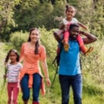 Family_enjoying_a_walk_through_the_countryside