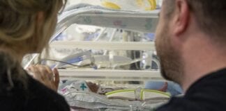 Letter – Don’t forget Cymru dads whose babies are in neonatal care Mum and Dad with baby in neonatal unit CRED Peter Nicholls