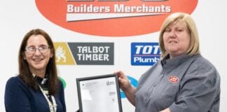 Adeiladu dyfodol llewyrchus i staff Sarah Colcombe right Stock Control Administrator receiving her award from her Line Manager Amanda Reed left Head of Procurement