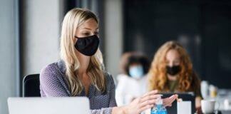 Enhanced cleaning is workers’ top priority for return to offices, despite studies showing coronavirus is airborne mask employees computer workplace covid