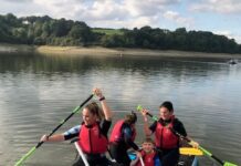 Study Reveals How Water-Based Activities Can Help Create A Healthy Work-Life Balance paddleboarding together