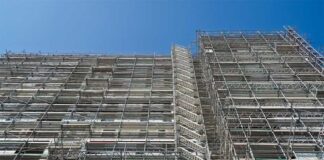 LGA responds to government plans to force developers to meet cladding costs scaffolding on a large block of flats 940 x 626