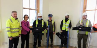 Llanelli MP Gives Seal Of Approval To Restoration Of Historic Local Landmark Nia Griffiths MP presents toolkit to Onsite Hub trainee at Llanelli Railway Goods Shed