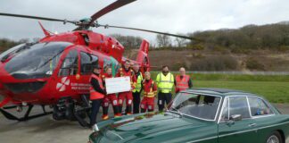 Ed donates £2,000 to Wales Air Ambulance after completing dawn to dusk challenge Ed Griffith cheque presentation scaled