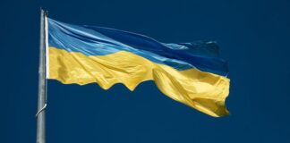 Warning about Russian threat actor Gamaredon: How to stay protected ahead of invasion anniversary cyber threat Ukraine flag against a blue sky