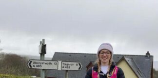 Hywel Dda Health Charities on fundraiser for Bronglais Chemo Appeal Carys Jones with collection bucket