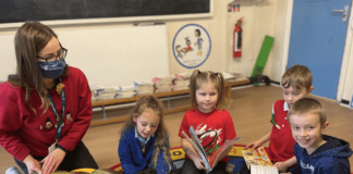 UWTSD provides enterprise education programme to 12 South West Wales schools UWTSD representative Mared Anthomy with children at Blaenymaes Primary School