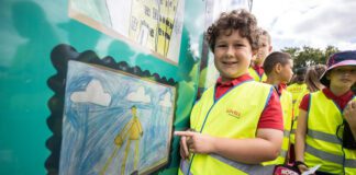 Pontllanfraith school children have artwork displayed at upcoming housing development CDF 150722 CF Lovell Primary Schools 038 A Pontllanfraith Primary School pupil admiring their artwork scaled