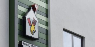 RONALD McDONALD HOUSE CHARITIES UK IS CELEBRATING ITS MILESTONE 5TH ANNIVERSARY Cardiff RMHC Logo on Building 1 July 2017 scaled