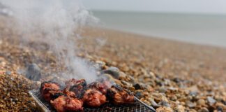 “BAN THEM: DAD’S DESPERATE PLEA AFTER SON’S FOOT “MELTED” BY DISPOSABLE BBQ PreparingbarbecueontheBeach1