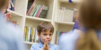 Is RE in schools a route to stopping the rise in religious hate crime? Young School Boy With His Hands Clasped 000057656168 Full copy scaled