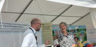 Beti George launches Welsh language and culture discovery process for Hywel Dda at National Eisteddfod Beti George and Huw Thomas min