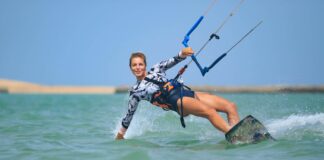 Is kitesurfing dangerous? How can you ensure 100% safety? Kiteboarding School Girl Learning scaled