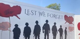 Housing partnership donates over £300 to Pontllanfraith Remembrance Day service memorial 3 The Remembrance Day hoarding at Chartist Garden Village min