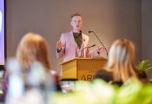 Owain Wyn Evans reveals new research about Wales’ hearing health Owain Wyn Evans addresses event 1 min