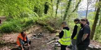 Neath College students help restore Craig Gwladus’ historic smithy Thom Alun Kinghorn Evans from the SPAB demonstrates traditional techniques to Neath College students min
