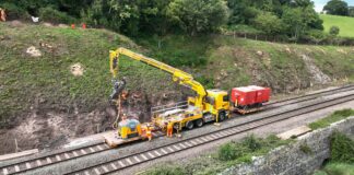 Further reliability boost for rail services between Newport and Gloucester as Network Rail completes second phase of multi-million-pound resilience scheme Drone shot of rope worker and rock bolt being drilled SERP 2023 min scaled