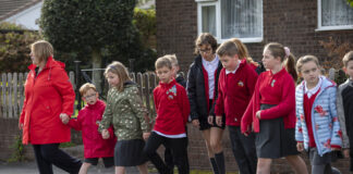 Welsh families urged to take to their feet this International Walk to School Month Pupils in Caldicot walk to school scaled