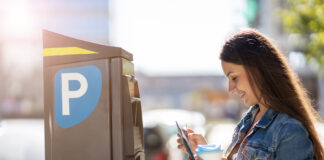 National Parking Platform looks to deliver a revolution in parking services woman and parking machine