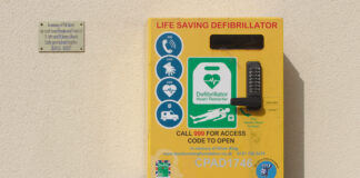 WALES TAKES THE LEAD AMONG THE HOME NATIONS IN CARDIAC ARREST SUPPORT WITH LAUNCH OF COMMUNITY CO-ORDINATORS Defibrillator at St John St James Church Orrell scaled