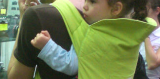 The three items new parents need to know how to use safely – RoSPA Baby sling in green 2