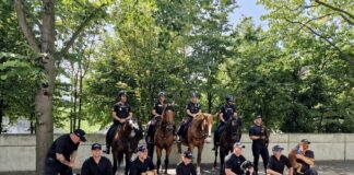 Dyfed-Powys officers deployed on mutual aid to Paris 2024 Olympic Games PC Mike Barnsley and PD Doug with dog handlers from NYPD