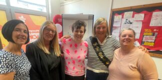 Sue Marsden retires after 33 years of supporting Carmarthenshire families sue with colleagues scaled