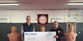 Local housebuilder donates £1,000 to Llanelli-based kickboxing club WKO Image