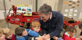 School children from across Pembrokeshire to learn about nutritious, delicious and local produce ysgol Bro Ingli year 2 pupils getting hands on with arable farmer Walter Simon