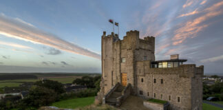 Retreats Group Celebrates Double Win at the Business Growth Wales Awards Roch Castle Pink Skies over St Brides Bay scaled