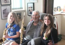 Legendary Saxophonist Returns To The Stage With Support From British Red Cross Graham and his grandchildren