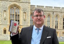 Volunteer receives MBE from Prince William in recognition of charity work Hywel Peterson MBE Windsor